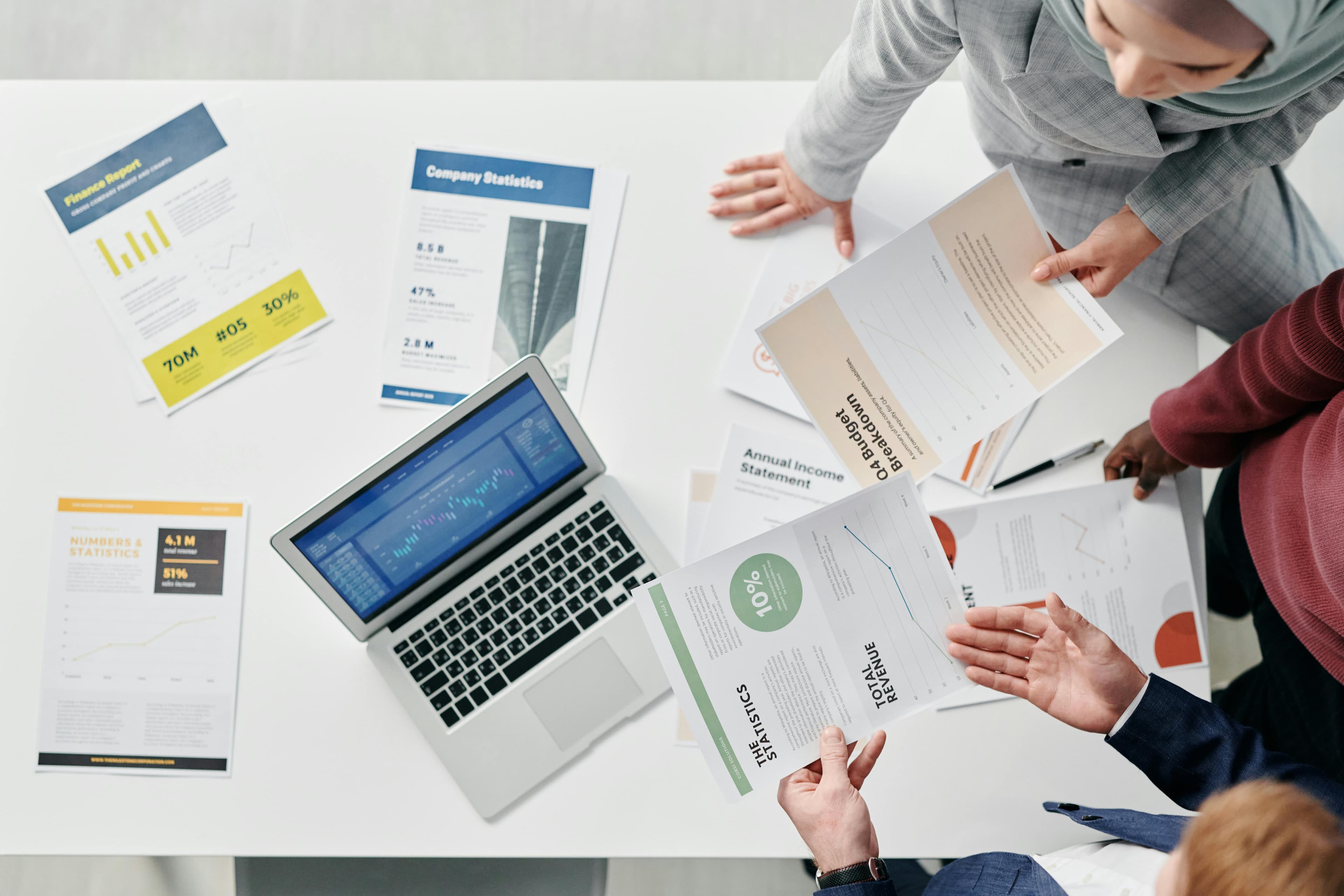 Financial planning documents and strategy discussion on a desk